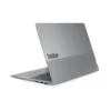 Silver Lenovo ThinkBook laptop angled to show keyboard and ports, featuring a sleek design with "ThinkBook" logo prominently displayed.
