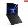 Lenovo Legion 5 15IRX10 - 2 A Lenovo Legion gaming laptop with a vibrant, rainbow-lit keyboard and a stunning fantasy landscape display.